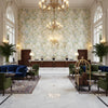 Chinese Peony Blue | Kravet - Hotel Lobby Visualization (AI-generated, may not be to scale. Verify pattern scale with product specifications.)