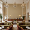 Dublin Linen camel | Kravet - Hotel Lobby Visualization (AI-generated, may not be to scale. Verify pattern scale with product specifications.)