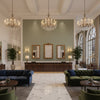 Dublin Linen sage green | Kravet - Hotel Lobby Visualization (AI-generated, may not be to scale. Verify pattern scale with product specifications.)
