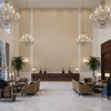 Oxford Velvet Sand | Kravet - Hotel Lobby Visualization (AI-generated, may not be to scale. Verify pattern scale with product specifications.)