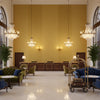 Skye Wool mustard | Kravet - Hotel Lobby Visualization (AI-generated, may not be to scale. Verify pattern scale with product specifications.)
