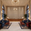 Fannin Plaid Ruby/Navy | Kravet - Hotel Lobby Visualization (AI-generated, may not be to scale. Verify pattern scale with product specifications.)