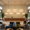 Kaya Ii Mist | Kravet - Hotel Lobby Visualization (AI-generated, may not be to scale. Verify pattern scale with product specifications.)