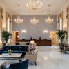 Cap Ferrat Stripe Marine | Kravet - Hotel Lobby Visualization (AI-generated, may not be to scale. Verify pattern scale with product specifications.)