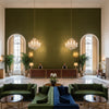 Gemma Velvet Moss | Kravet - Hotel Lobby Visualization (AI-generated, may not be to scale. Verify pattern scale with product specifications.)