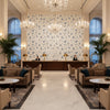 Hollin Print Indigo | Kravet - Hotel Lobby Visualization (AI-generated, may not be to scale. Verify pattern scale with product specifications.)