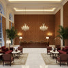 Allonby Weave Cinnabar | Kravet - Hotel Lobby Visualization (AI-generated, may not be to scale. Verify pattern scale with product specifications.)