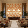 Aurora Terracota | Kravet - Hotel Lobby Visualization (AI-generated, may not be to scale. Verify pattern scale with product specifications.)