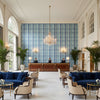 Fisher Plaid Capri/Sky | Kravet - Hotel Lobby Visualization (AI-generated, may not be to scale. Verify pattern scale with product specifications.)