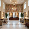 Posy Print Berry/Leaf | Kravet - Hotel Lobby Visualization (AI-generated, may not be to scale. Verify pattern scale with product specifications.)