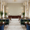Ultrasuede Green pale taupe | Kravet - Hotel Lobby Visualization (AI-generated, may not be to scale. Verify pattern scale with product specifications.)
