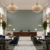 Ultrasuede Green gray | Kravet - Hotel Lobby Visualization (AI-generated, may not be to scale. Verify pattern scale with product specifications.)