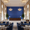 Ultrasuede Green cobalt blue | Kravet - Hotel Lobby Visualization (AI-generated, may not be to scale. Verify pattern scale with product specifications.)