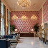 CORNWALL Wallcoverings (AF15124) – Red and Blue | Thibaut - Hotel Lobby Visualization (AI-generated, may not be to scale. Verify pattern scale with product specifications.)