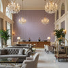 WYNFORD Fabrics (AF23148) – Plum | Thibaut - Hotel Lobby Visualization (AI-generated, may not be to scale. Verify pattern scale with product specifications.)