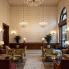 ELLERY STRIPE Fabrics (AF24541) – White on Beige | Thibaut - Hotel Lobby Visualization (AI-generated, may not be to scale. Verify pattern scale with product specifications.)