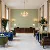 LINDSEY Fabrics (AF57814) – Green | Thibaut - Hotel Lobby Visualization (AI-generated, may not be to scale. Verify pattern scale with product specifications.)