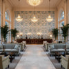 NARBETH Fabrics (AF57858) – Blue and Green | Thibaut - Hotel Lobby Visualization (AI-generated, may not be to scale. Verify pattern scale with product specifications.)
