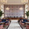 NARBETH Fabrics (AF57861) – Red and Blue | Thibaut - Hotel Lobby Visualization (AI-generated, may not be to scale. Verify pattern scale with product specifications.)