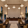 HERRIOT WAY EMBROIDERY Fabrics (AF9637) – ivory | Thibaut - Hotel Lobby Visualization (AI-generated, may not be to scale. Verify pattern scale with product specifications.)