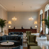 BF10956.615.0 | Kravet - Hotel Lobby Visualization (AI-generated, may not be to scale. Verify pattern scale with product specifications.)