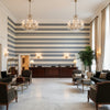 T8019101.5.0 | Kravet - Hotel Lobby Visualization (AI-generated, may not be to scale. Verify pattern scale with product specifications.)
