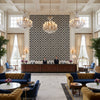 TL10136.8.0 | Kravet - Hotel Lobby Visualization (AI-generated, may not be to scale. Verify pattern scale with product specifications.)