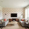Spencer Corla Sawgrass Cream & Coral Wallcovering | Jeffrey Stevens - Living Room Visualization (AI-generated, may not be to scale. Verify pattern scale with product specifications.)