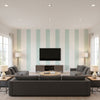 Andreas Stripe Aqua | Thibaut Wallcoverings - Living Room Visualization (AI-generated, may not be to scale. Verify pattern scale with product specifications.)