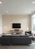 Odaiba Printed Texture | Architectural Wallcoverings - Living Room Visualization (AI-generated, may not be to scale. Verify pattern scale with product specifications.)