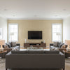 Adhafera Scroll Oatmeal | Schumacher Wallcovering - Living Room Visualization (AI-generated, may not be to scale. Verify pattern scale with product specifications.)